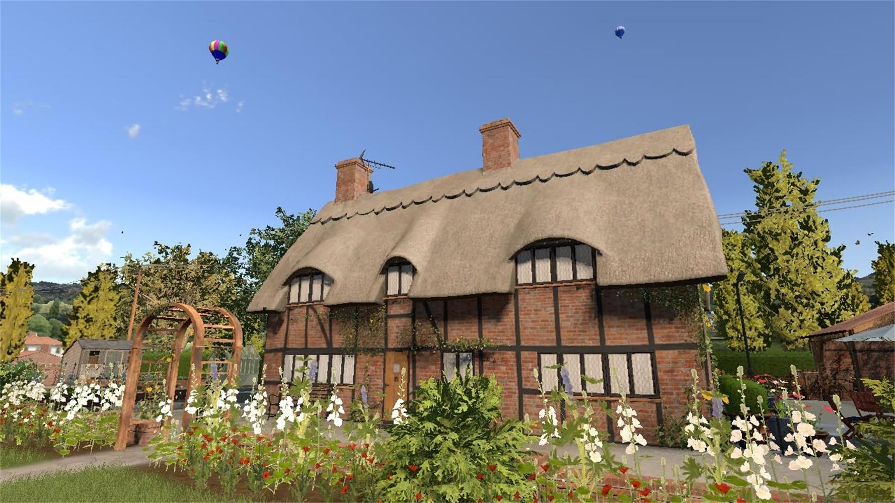 Ein Reetdachhaus mit Garten und zwei Heißluftballons am Himmel.