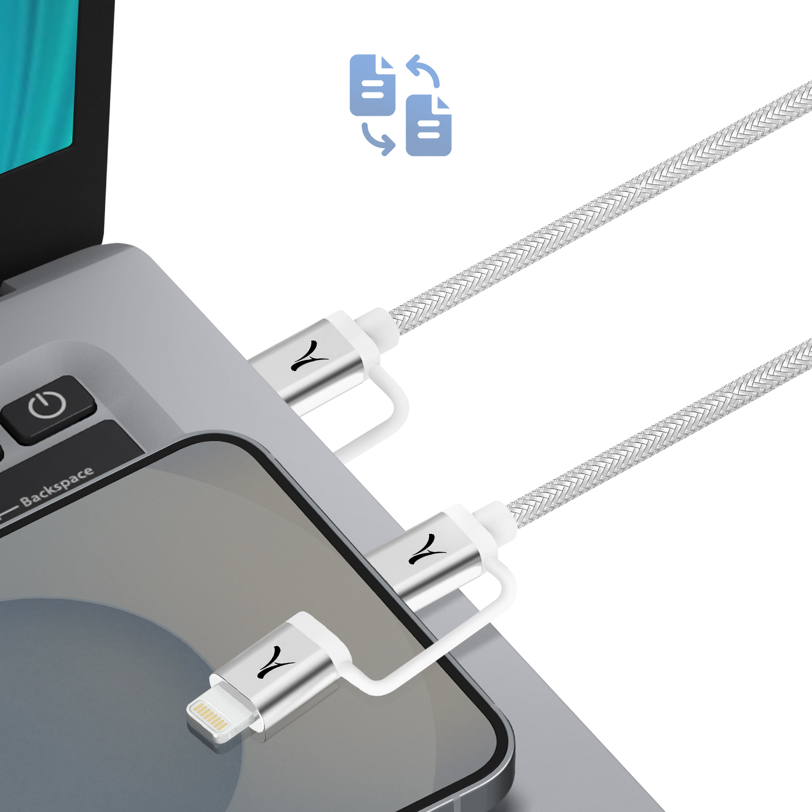 Un câble argenté relie un smartphone à un ordinateur portable.