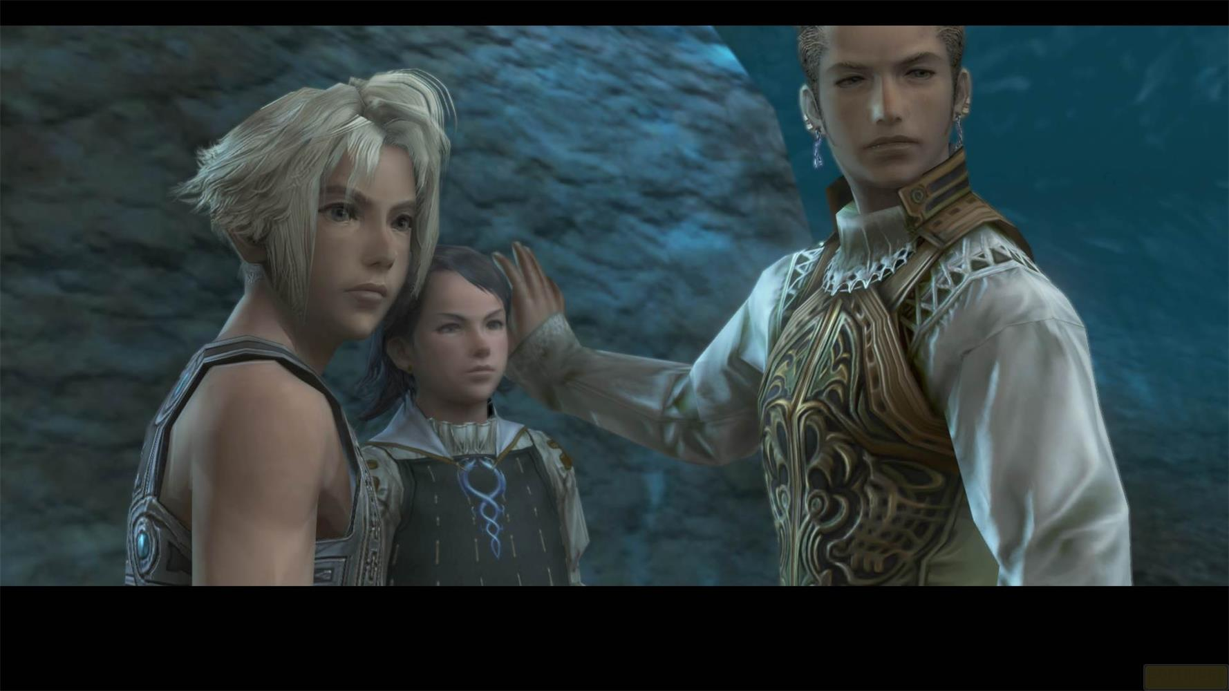 Trois personnages devant un mur de roche. L'un pose une main sur le visage d'un autre.