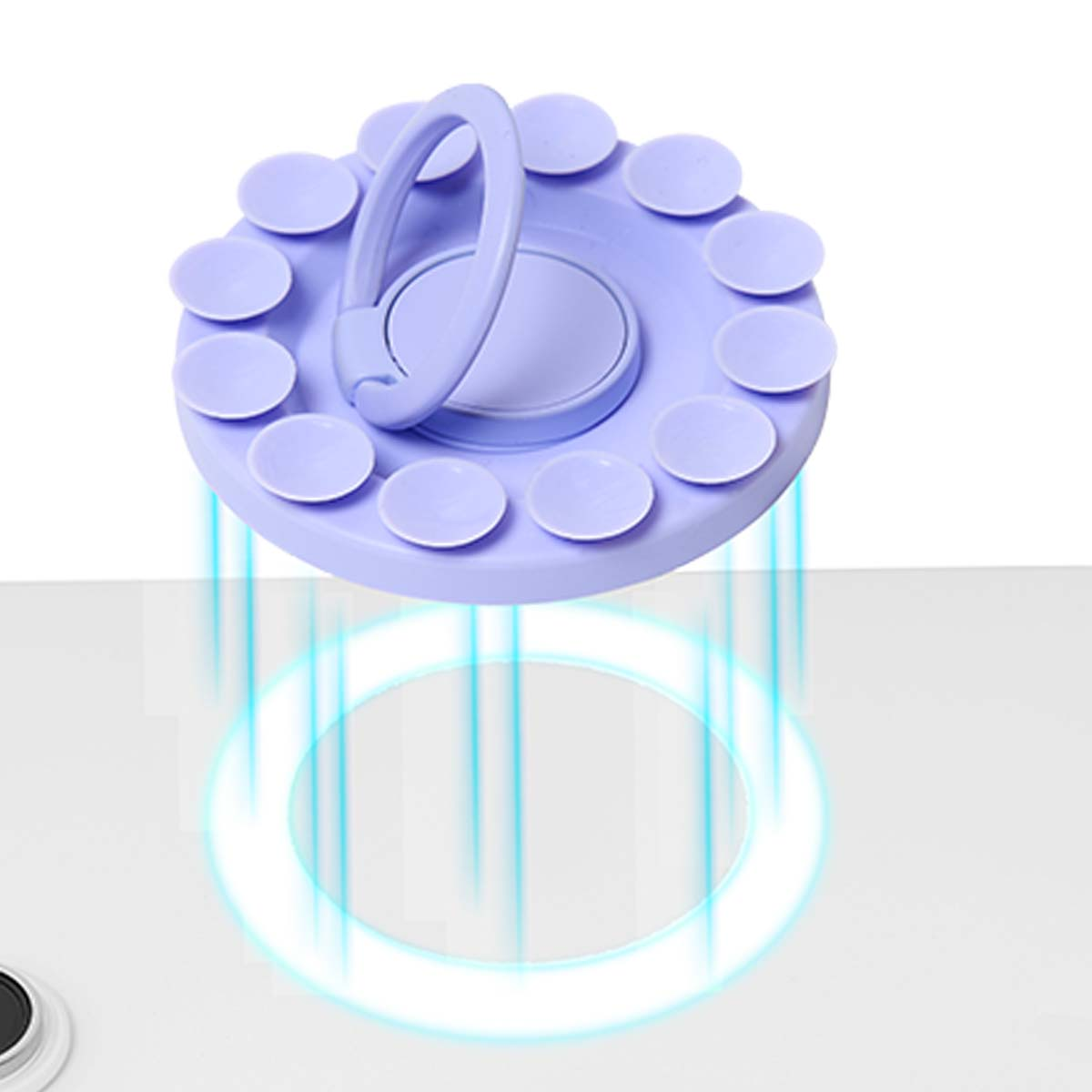Ein lila Handy-Ringhalter mit Saugnäpfen und einem Ring, der auf einer weißen Oberfläche schwebt.