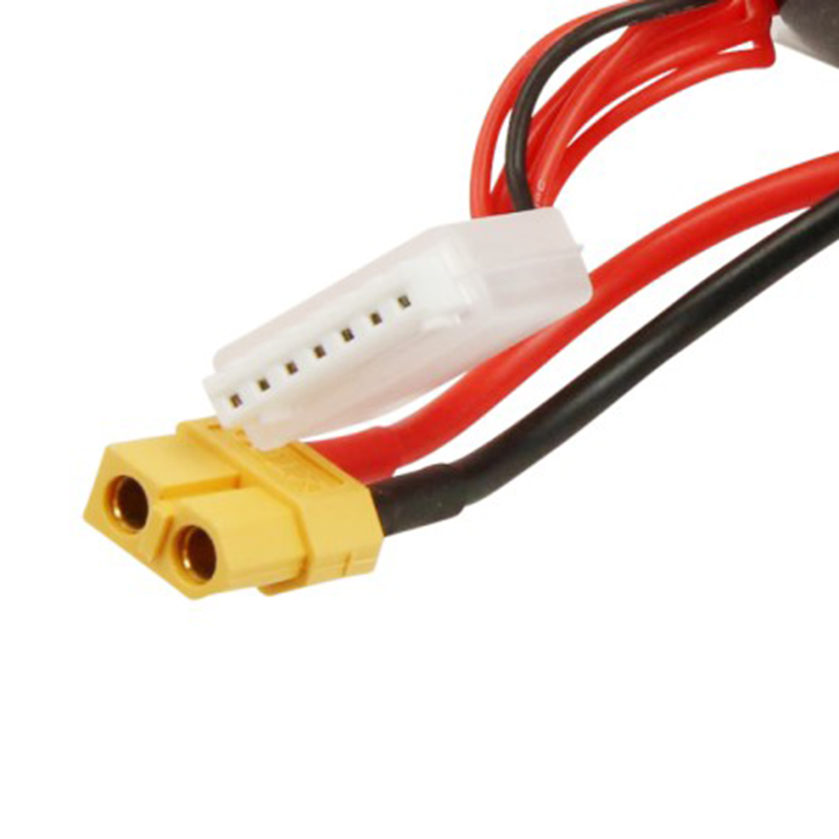 Ein gelber Stecker mit zwei runden Anschlüssen und ein weißer Stecker.