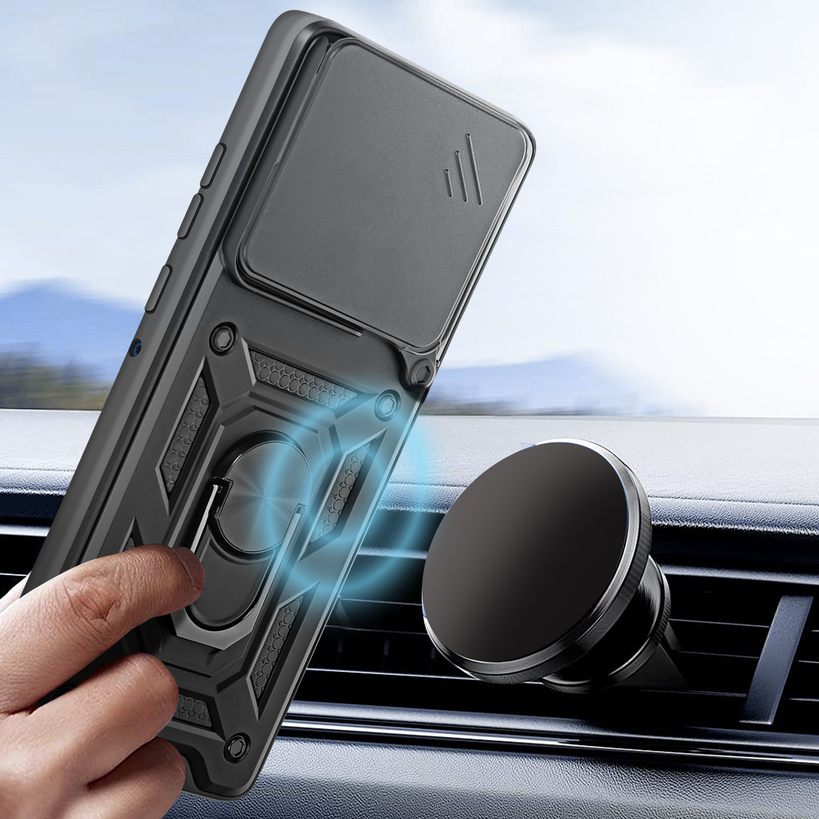 Een zwarte telefoonhoes met ringhouder is aan een auto-ventilatie bevestigd.