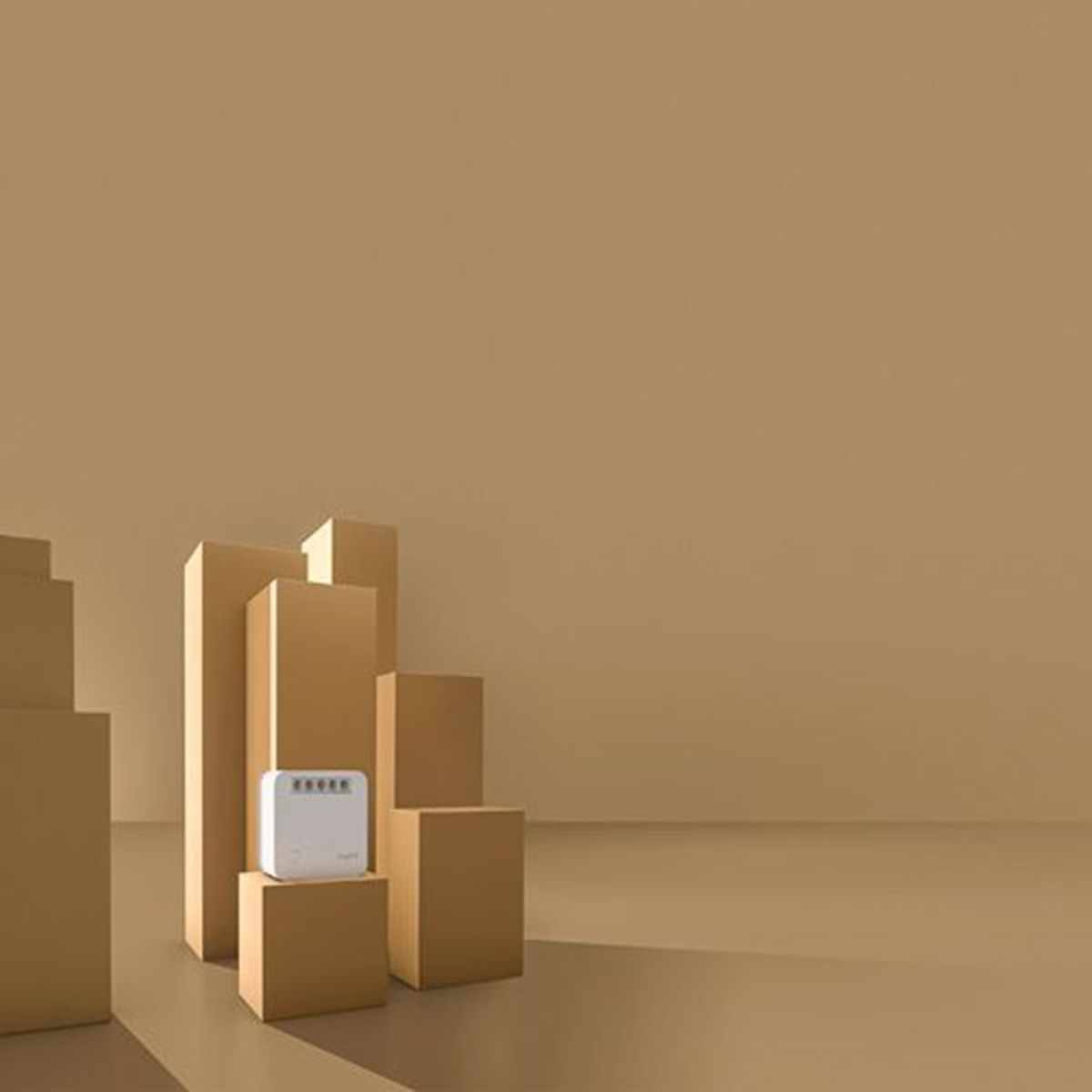 Un dispositivo bianco con quattro luci è posato su una scatola marrone.