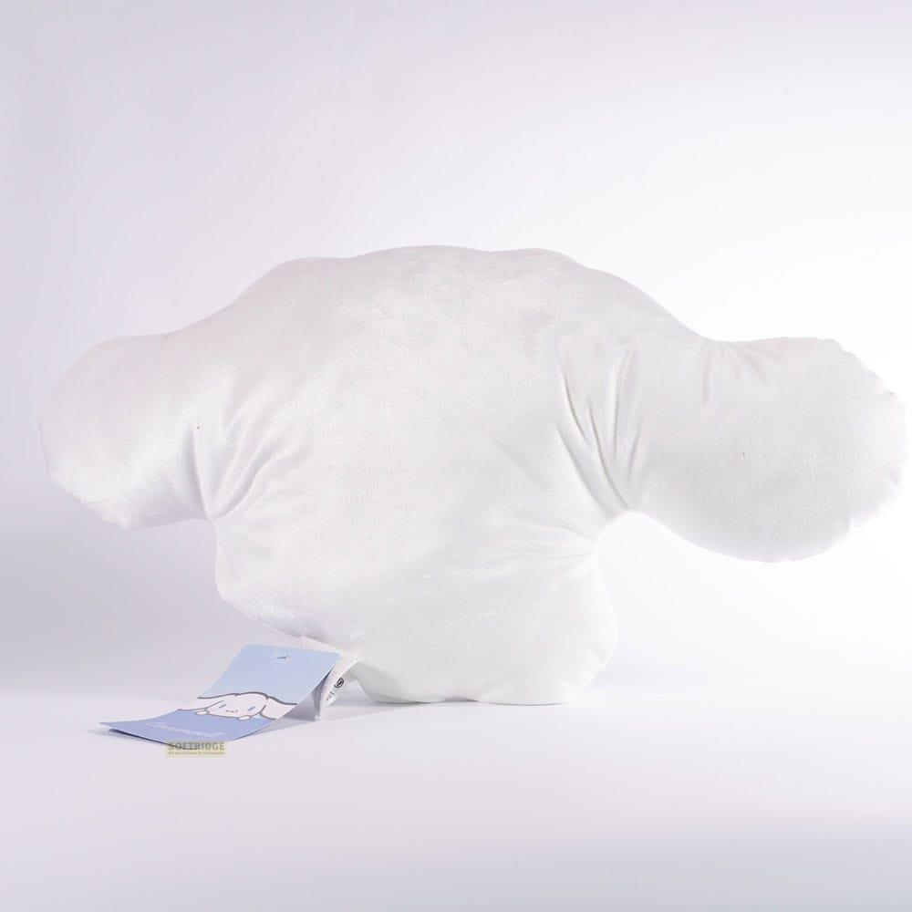 Una almohada blanca con forma de nube con una etiqueta azul.