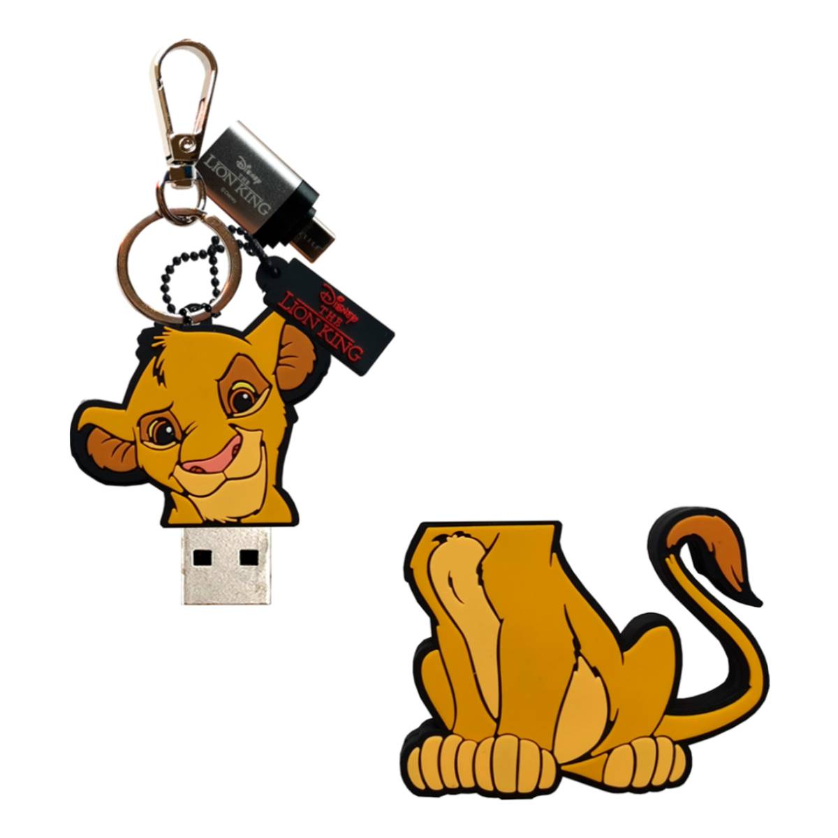 Ein Simba-Schlüsselanhänger-USB-Stick und eine sitzende Simba-Figur.