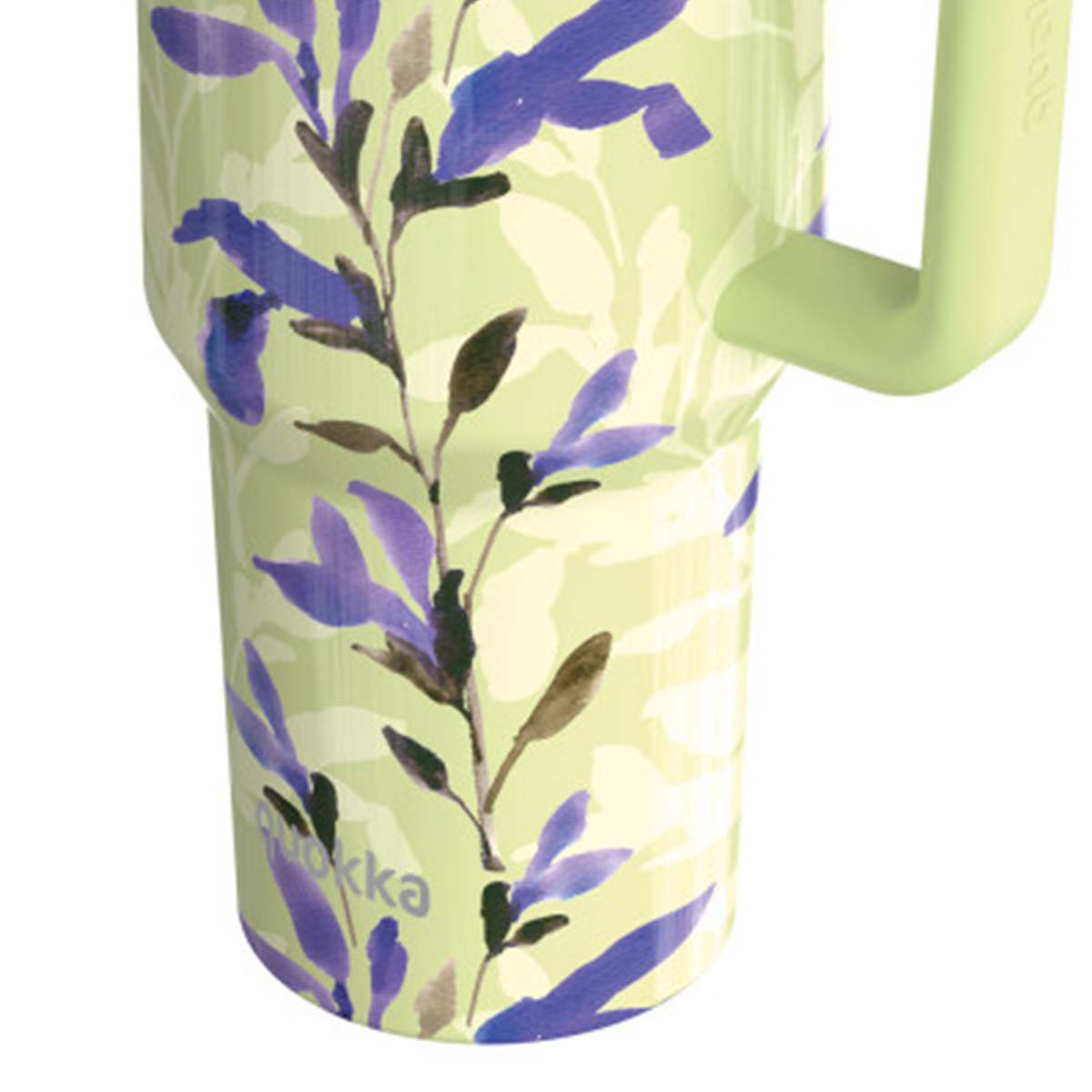 Tazza verde chiaro con motivo a foglie viola e verdi e manico verde chiaro.