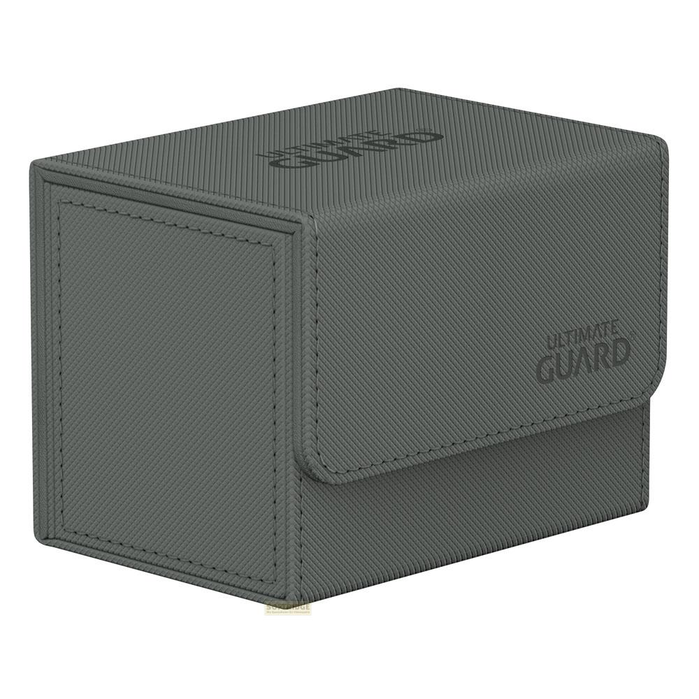 Une boîte de deck grise, texturée et fermée avec le logo "ULTIMATE GUARD" en relief.