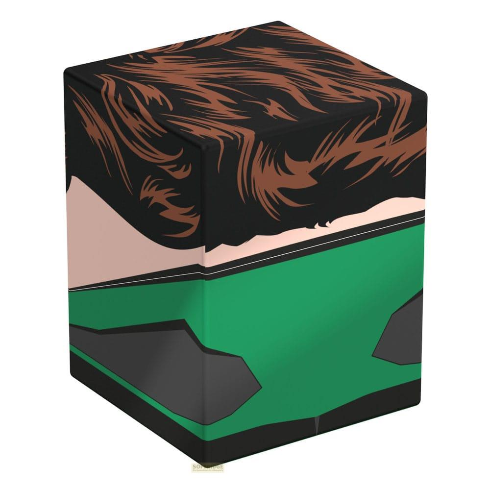 Un cube avec un design de cheveux bruns, cou noir et vêtements verts.