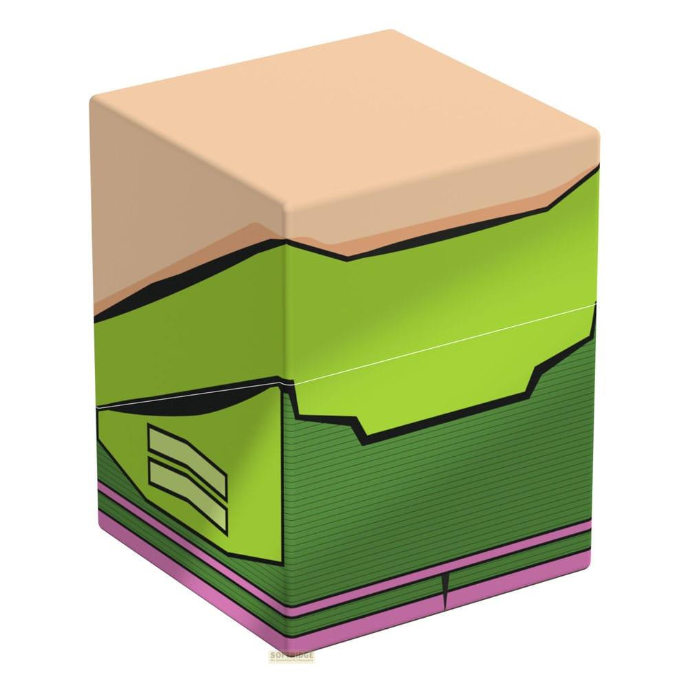 Une boîte cubique avec un dessus marron clair, des côtés verts à motifs et une base rose.