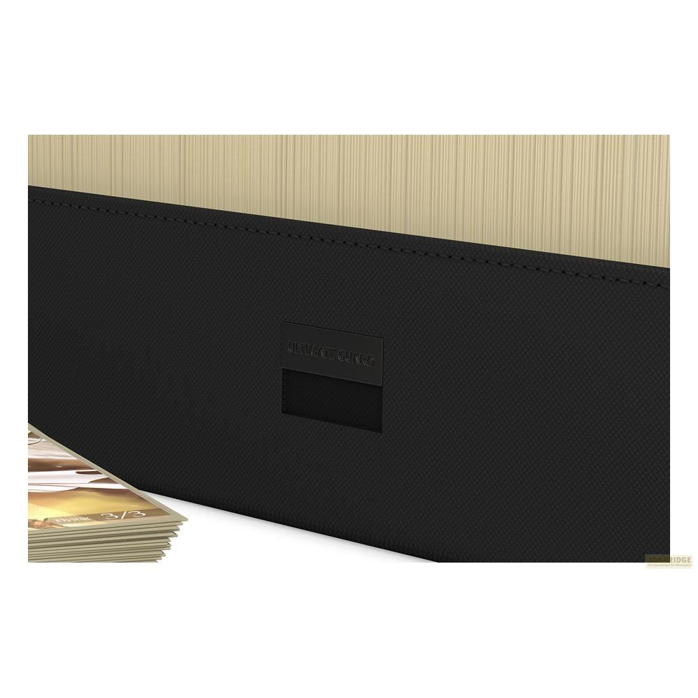 Boîte de deck noire avec fond texturé beige. Cartes visibles à gauche.