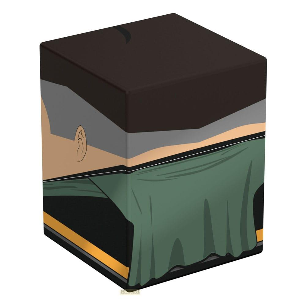 Un cube montre le profil d'un homme aux cheveux sombres, vêtements gris et tissu vert.