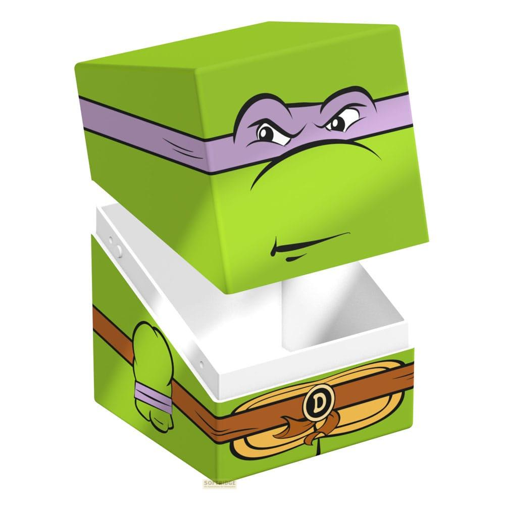 Une boîte verte avec un visage de personnage de dessin animé, masque violet.