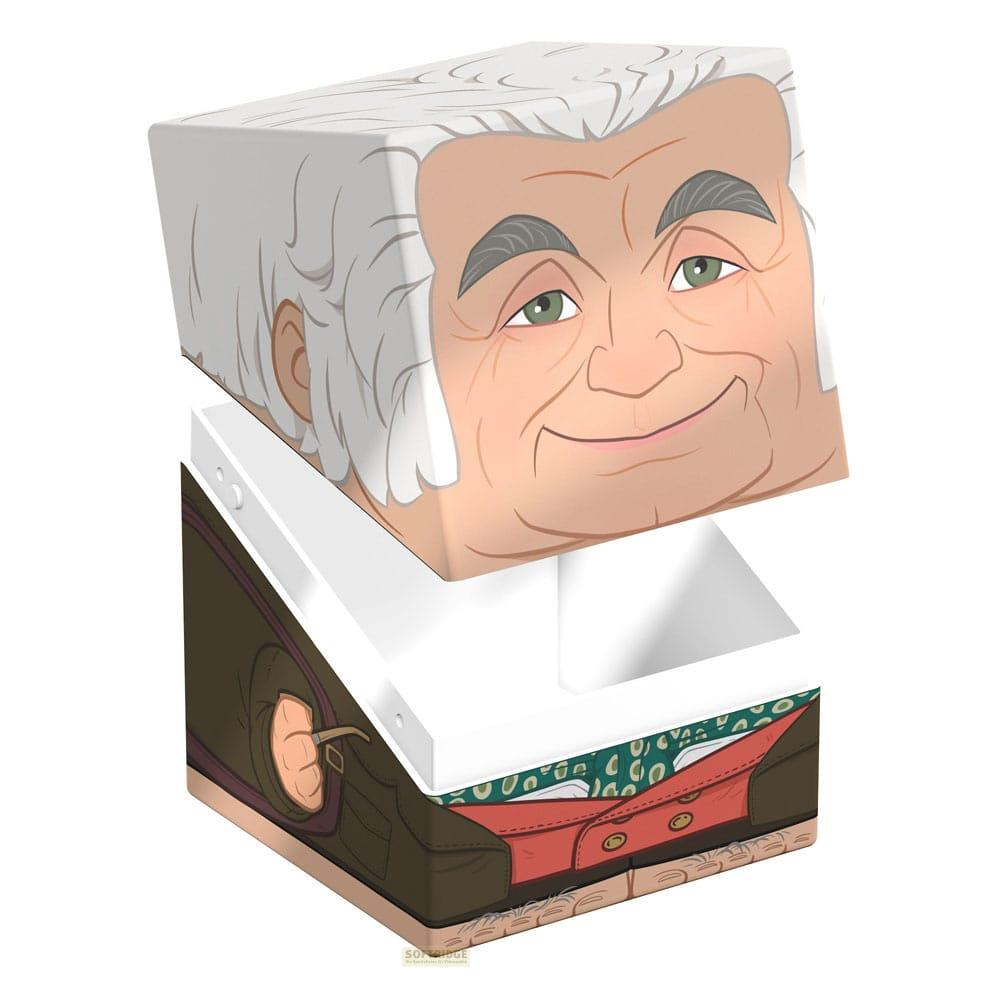 Une boîte ouverte montre le dessus d'un visage souriant et le dessous d'un homme en vêtements.