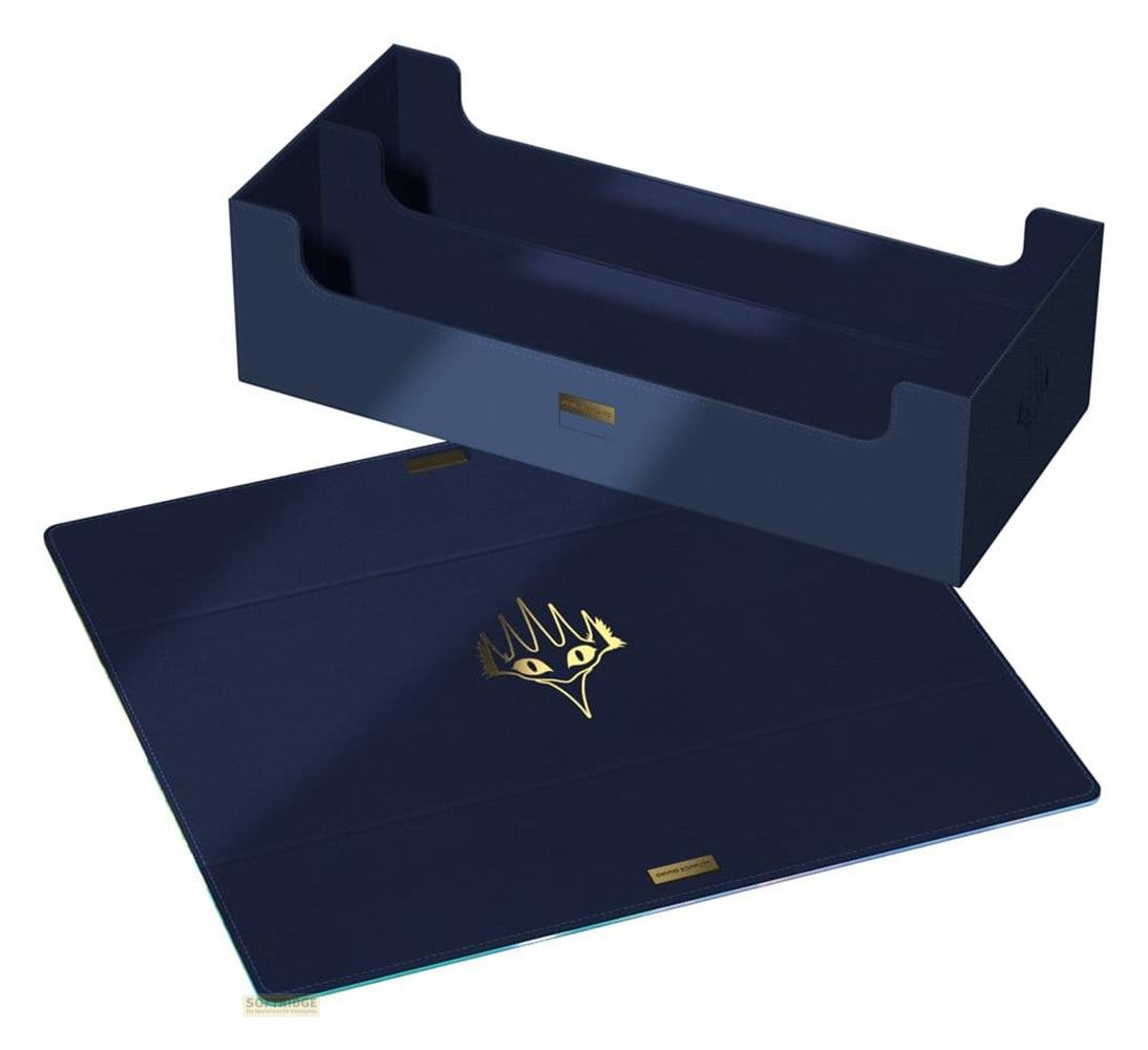Boîte à cartes et tapis de jeu bleu foncé avec un symbole doré.