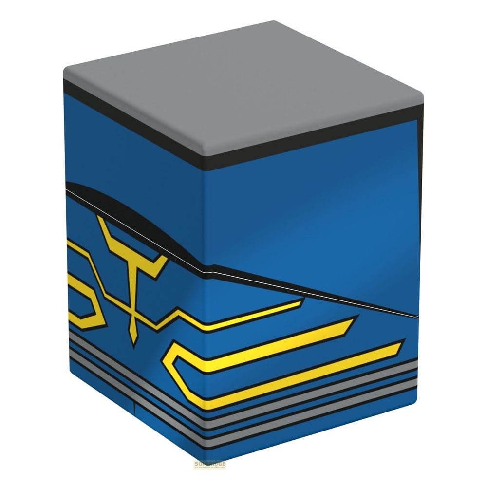 Ein blauer Würfel mit gelben Akzenten und einem grauen Deckel.
