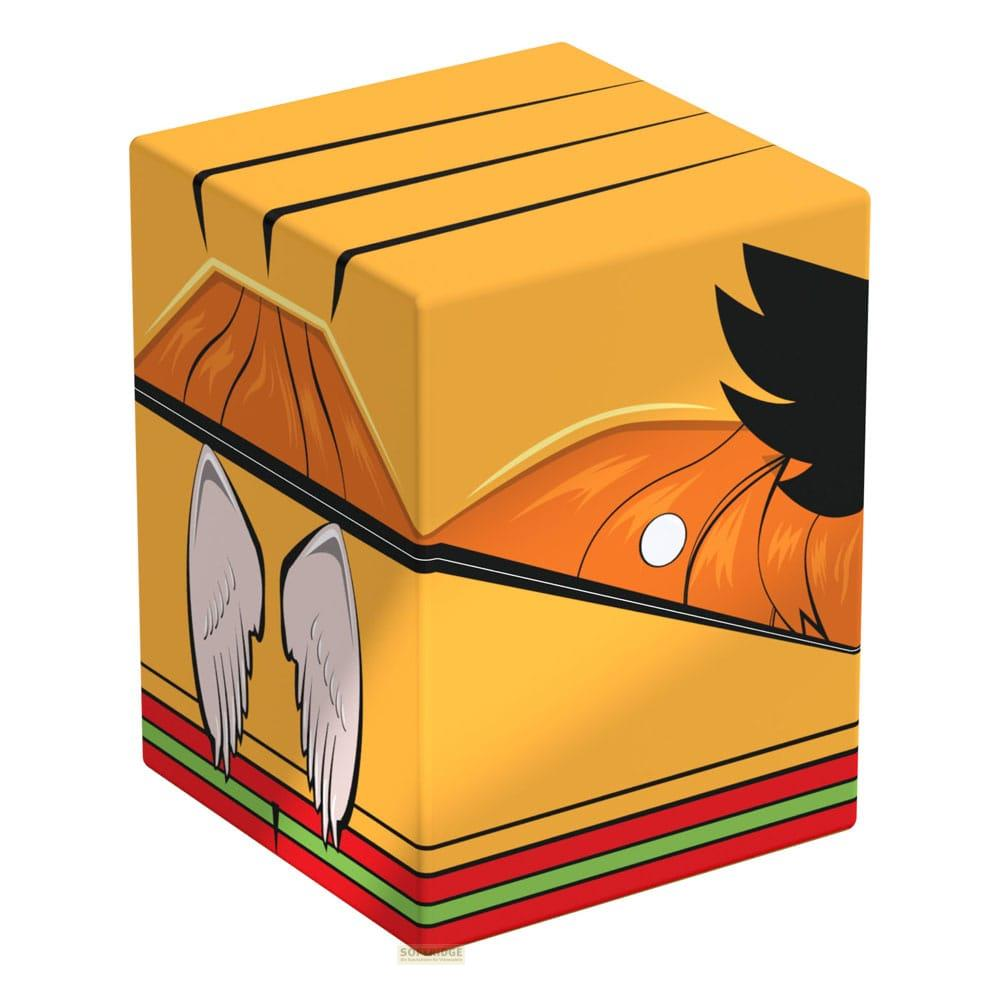 Gelbe Box mit schwarzem Haar, Flügeln und orangefarbener Gesichtszeichnung.
