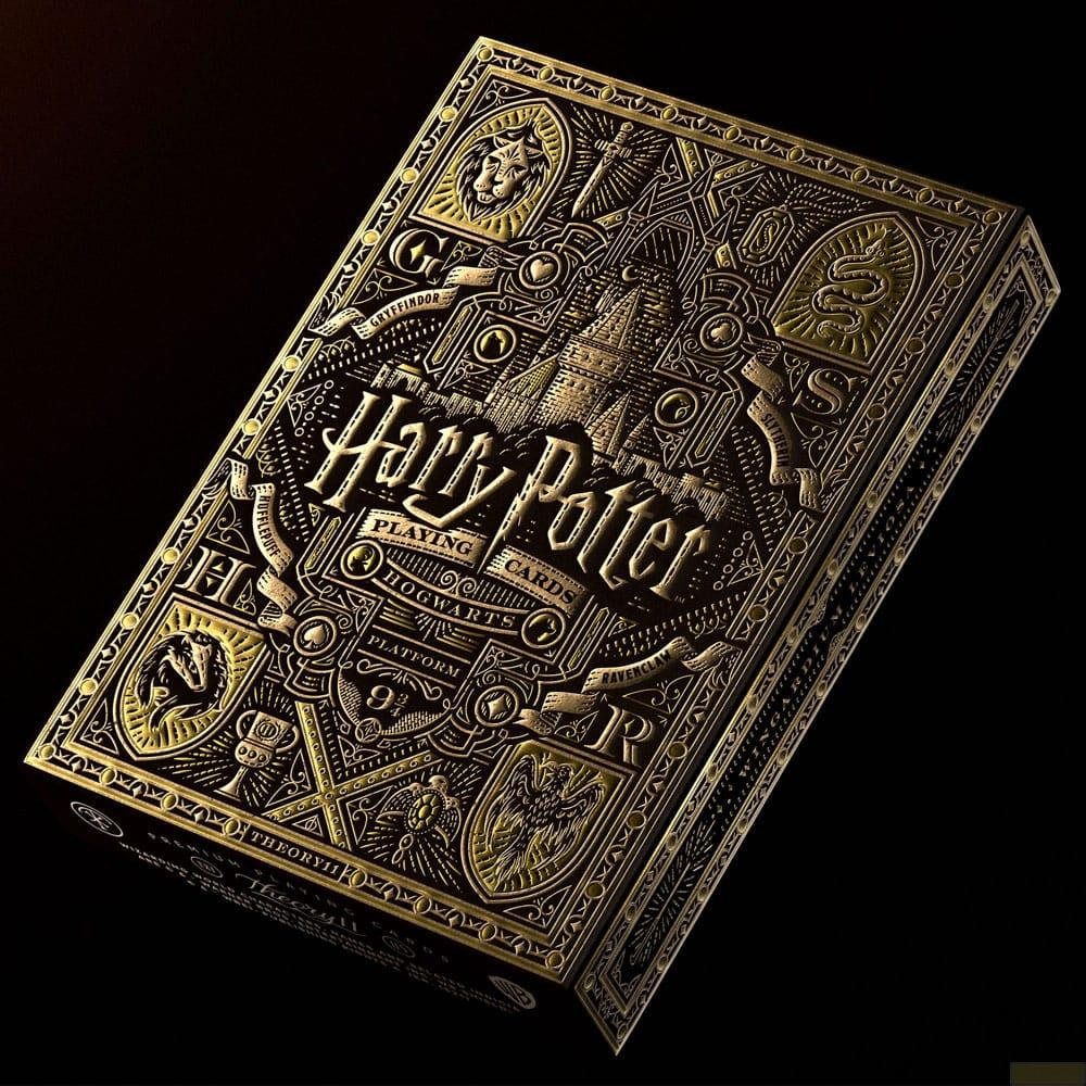Scatola dorata di carte da gioco Harry Potter con castello di Hogwarts.