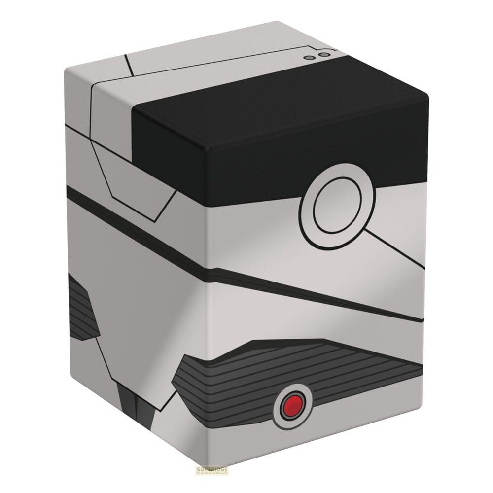 Un cube gris avec des lignes noires et un bouton rouge.