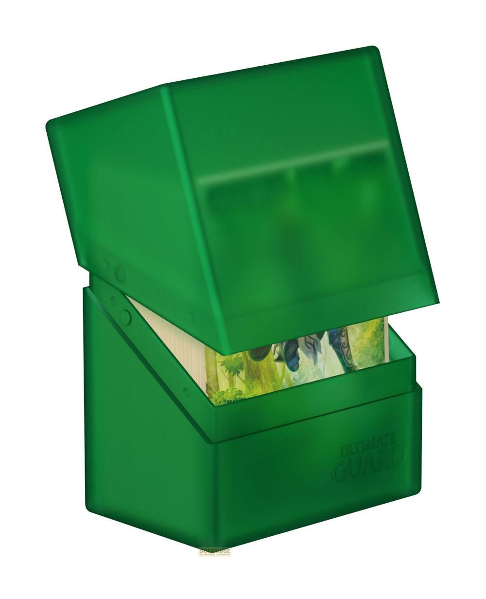 Un porte-cartes vert avec son couvercle ouvert, contenant des jeux de cartes.