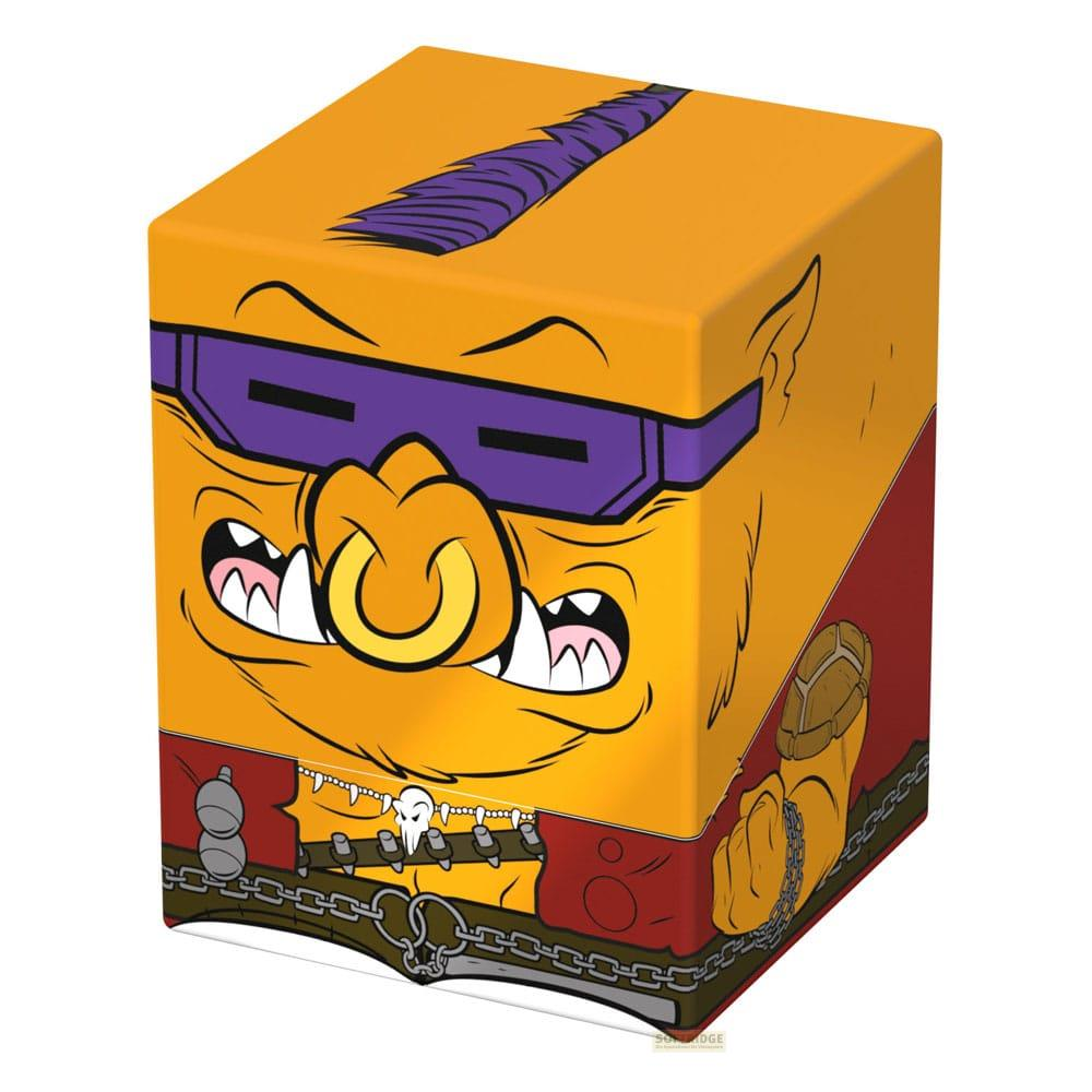 Cubo giallo con faccia di mostro cartone animato, occhiali viola, anello naso giallo.