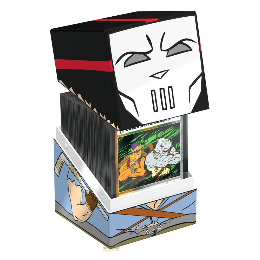 Boîte de jeu de cartes avec la tête de Shredder sur le dessus, remplie de cartes.