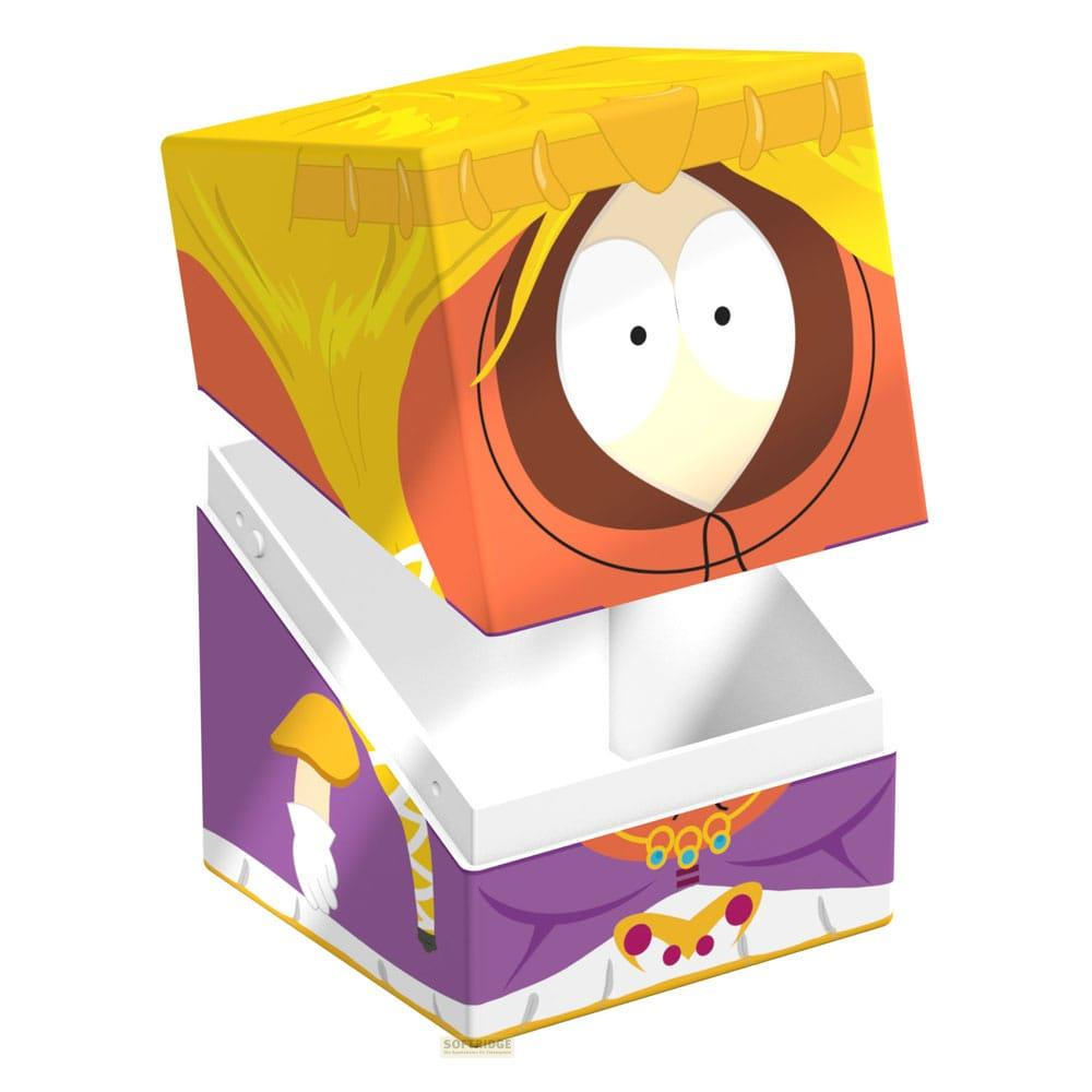 Una scatola aperta con Kenny di South Park che indossa un abito arancione e un cappuccio giallo.