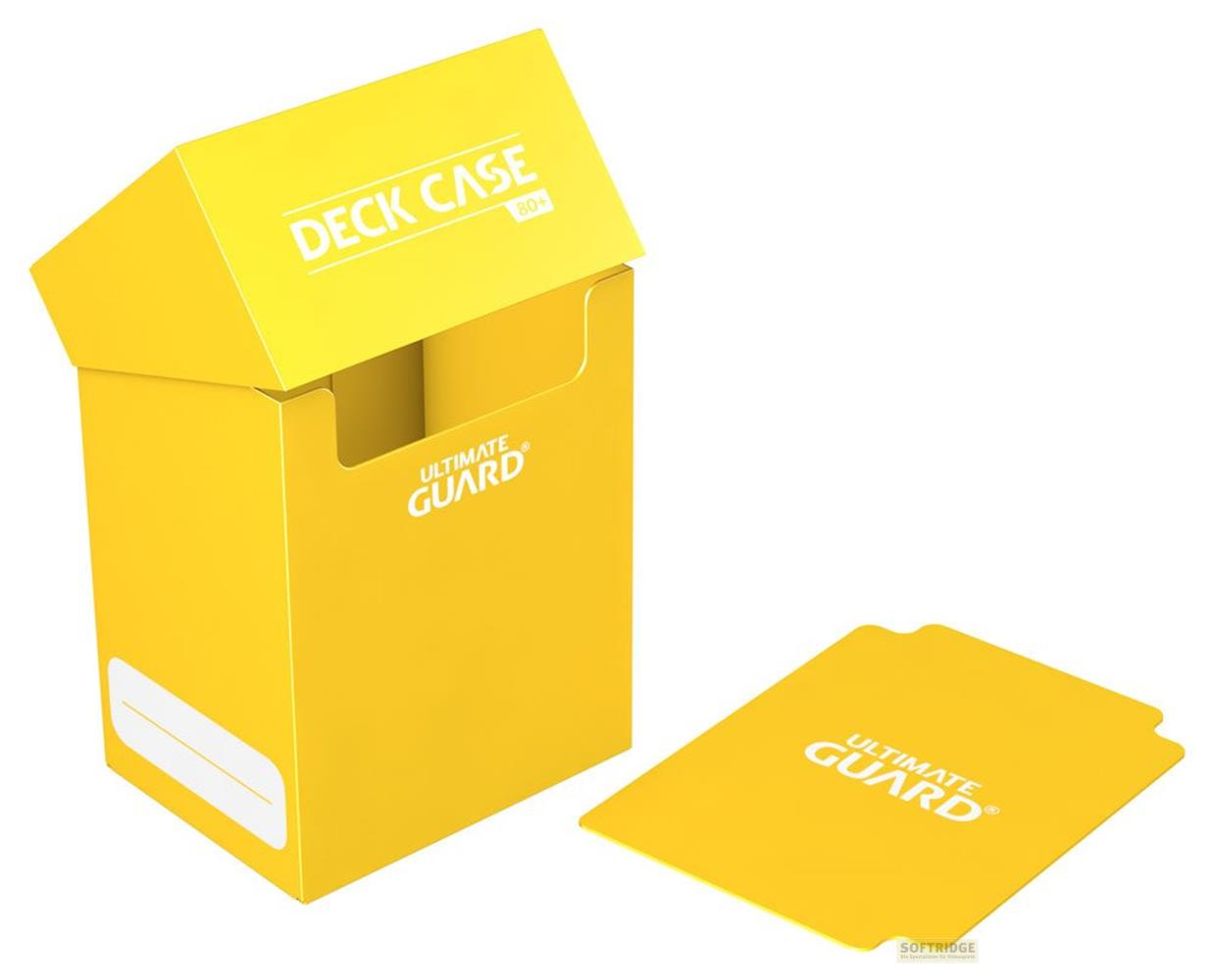 Una scatola gialla "Deck Case" per giochi di carte con coperchio e due custodie per carte accanto.