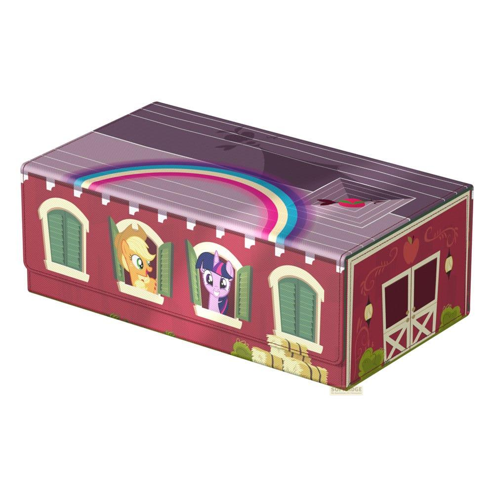 Une boîte rouge avec des personnages de My Little Pony aux fenêtres, avec un arc-en-ciel.