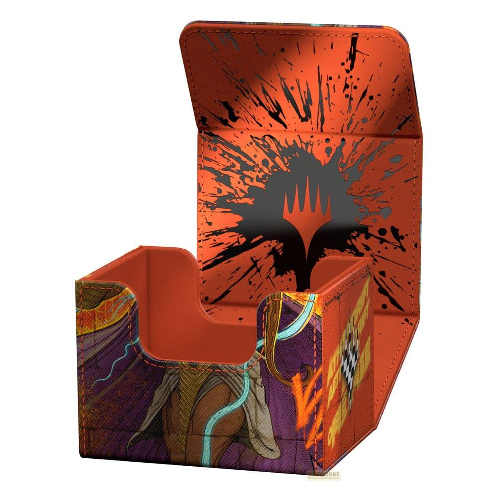 Boîte de deck orange avec motif éclaboussures noir et logo, ouverte.