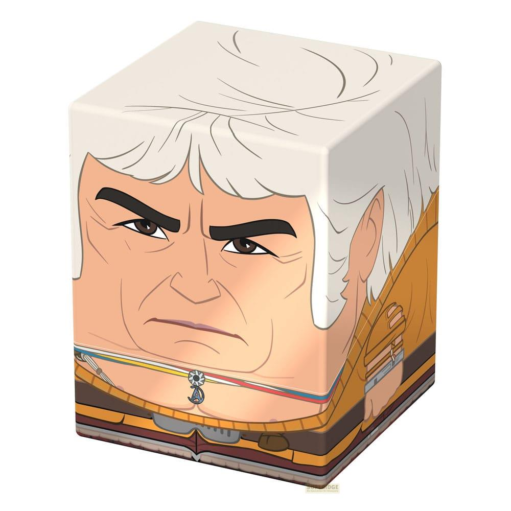 Oggetto a forma di cubo con il volto di un uomo dai capelli bianchi ed espressione severa.