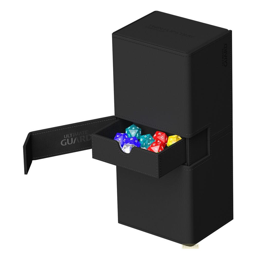 Boîte de rangement noire avec tiroir extractible rempli de dés colorés.