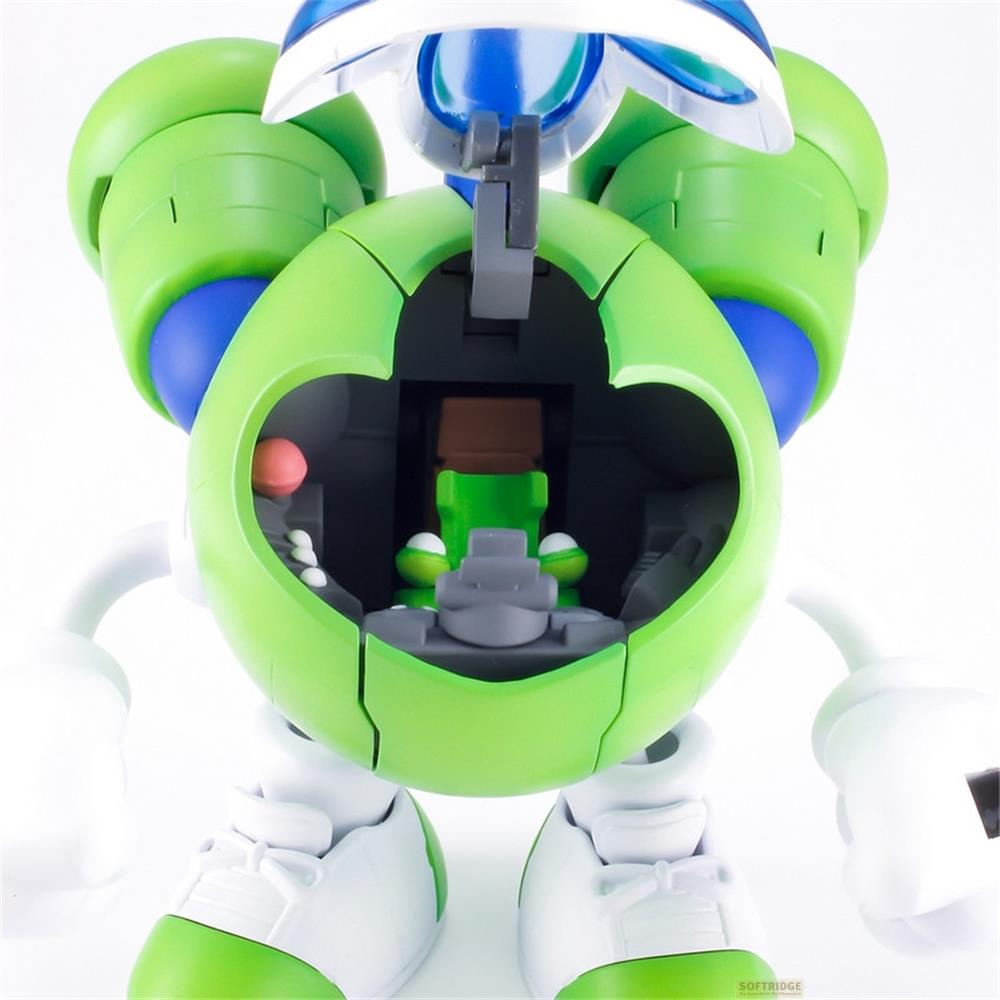 Une figurine de robot verte avec le ventre ouvert, révélant une petite créature verte.