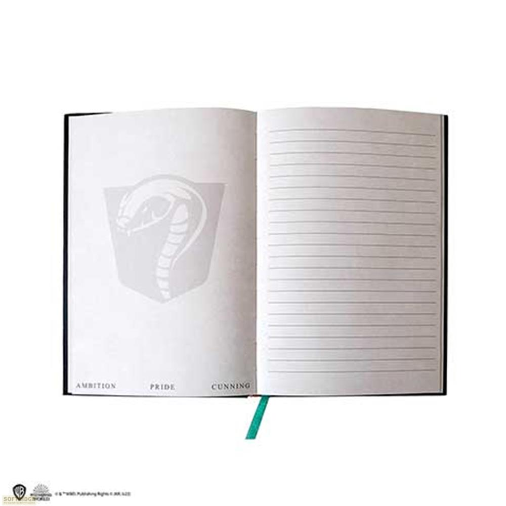 Ein offenes Notizbuch mit einem Schlangensymbol und Linien auf der rechten Seite.