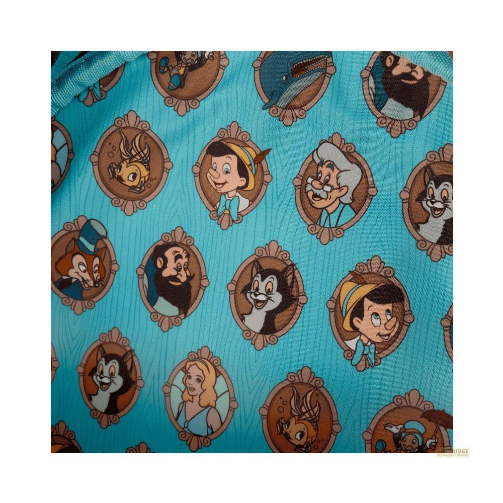Patrón de personajes de Disney en marcos ovalados sobre fondo azul.
