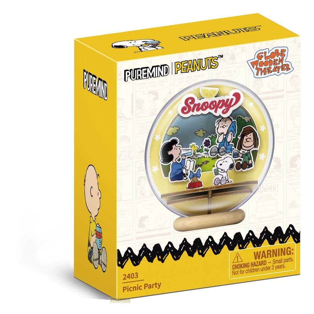 Boîte Peanuts avec scène Snoopy et étiquette d'avertissement.