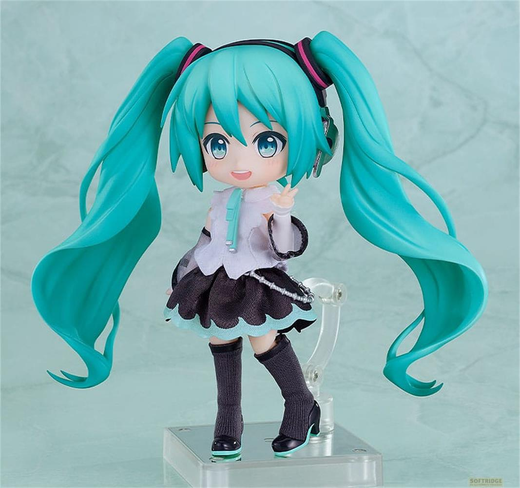 Una figura carina con capelli turchesi e gonna nera, in posa.