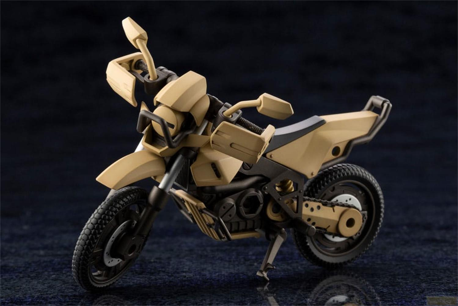 Une moto beige avec pneus et détails noirs repose sur une surface sombre.