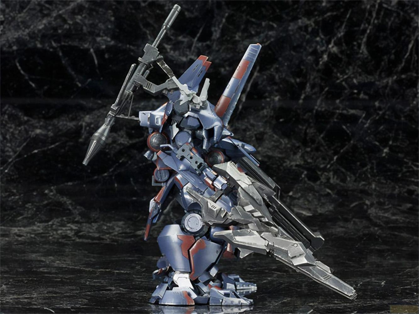 Un mecha bleu et rouge avec des armes se tient sur une surface sombre.