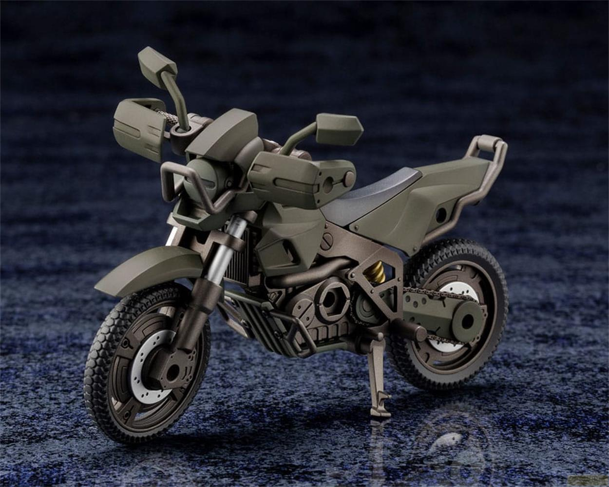 Une moto vert olive aux pneus tout-terrain sur une surface sombre et brillante.