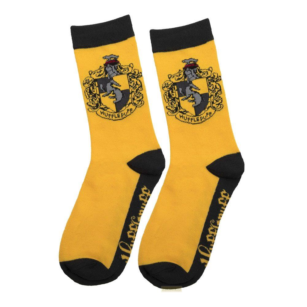 Gelbe Socken mit Hufflepuff-Wappen und schwarzem Bündchen.