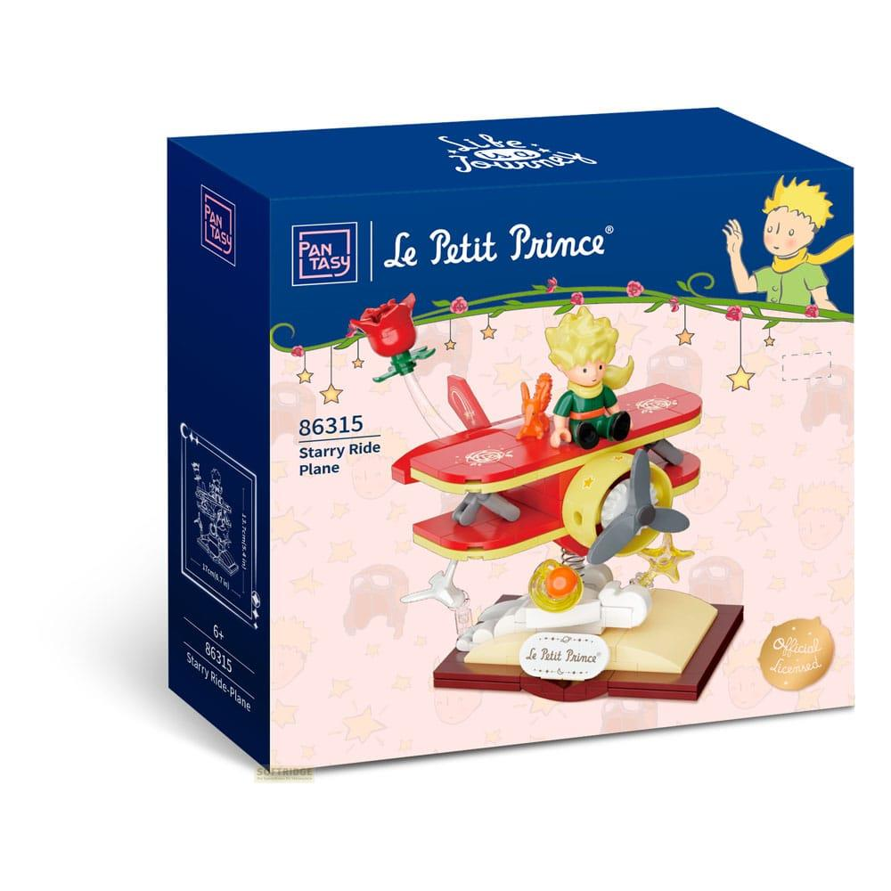 Die Schachtel zeigt ein rot-gelbes Spielzeugflugzeug mit einer Figur des Kleinen Prinzen.