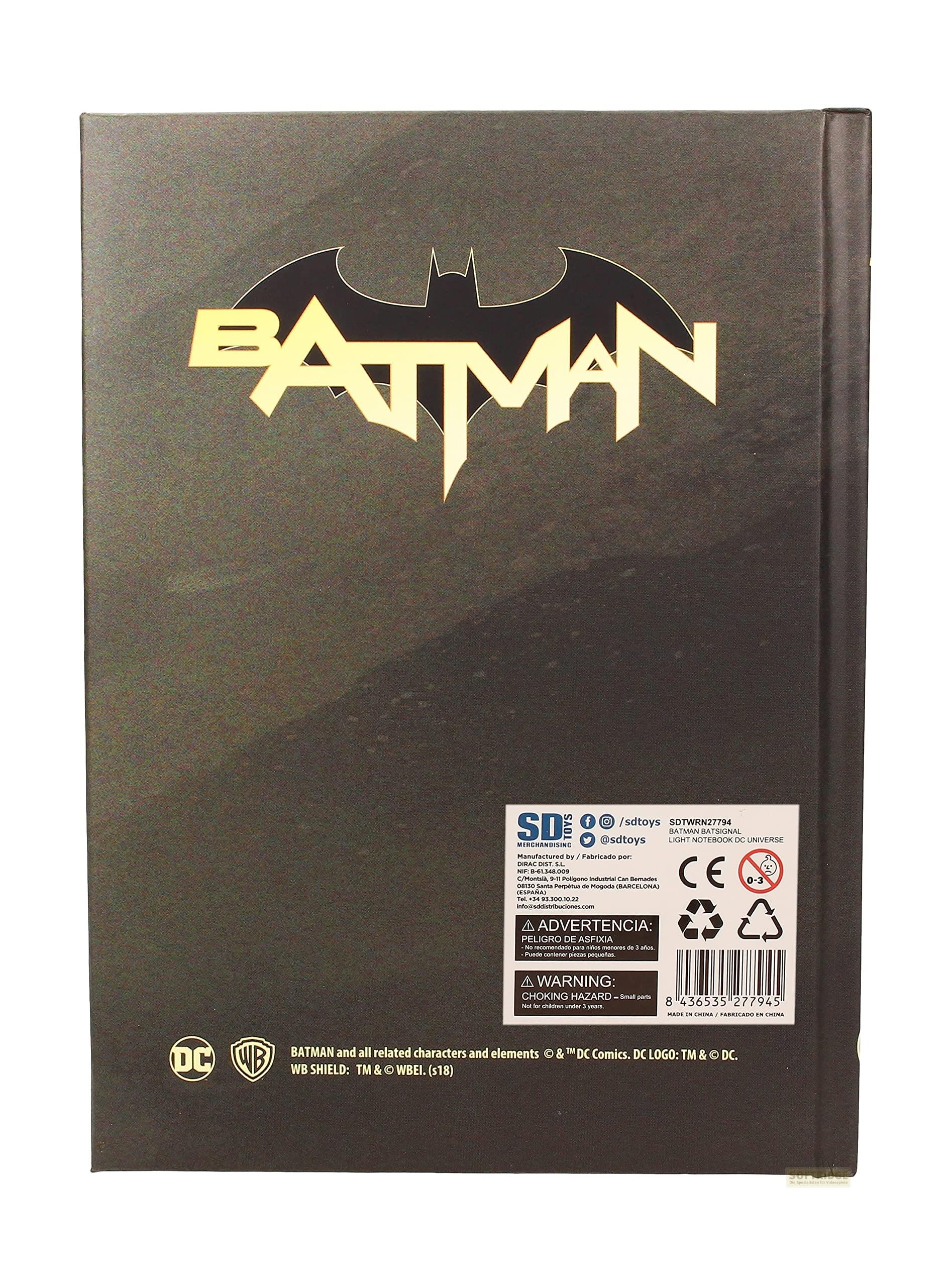 Schwarzes Notizbuch mit goldenem Batman-Logo und DC-Logos unten.