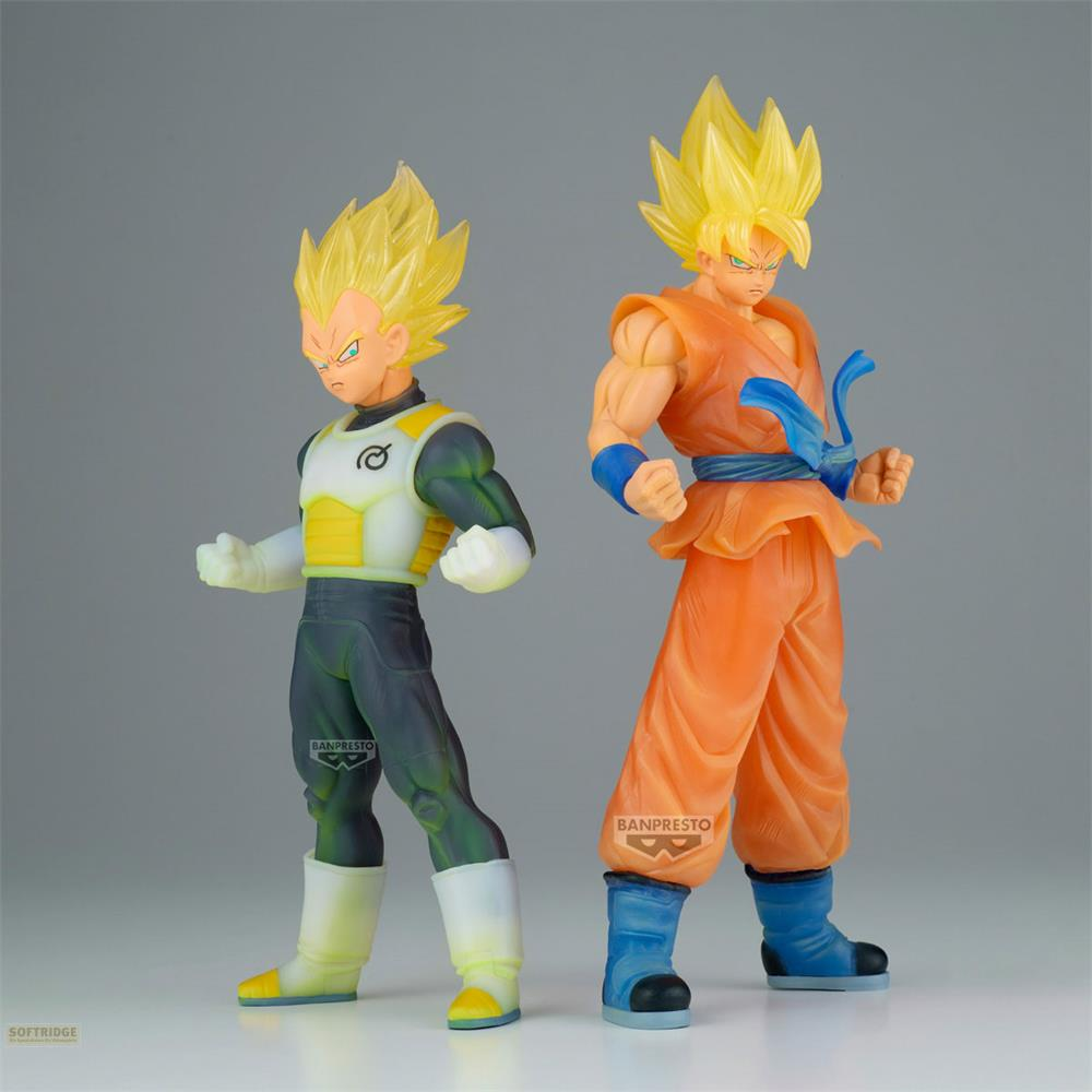 Dos figuras de anime con pelo amarillo: Goku de naranja y Vegeta de blanco/verde/gris.