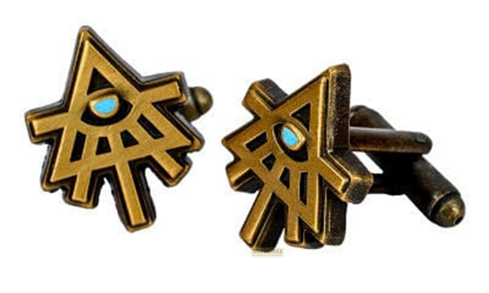 Zwei goldene Manschettenknöpfe mit einem stilisierten Auge und blauen Akzenten.