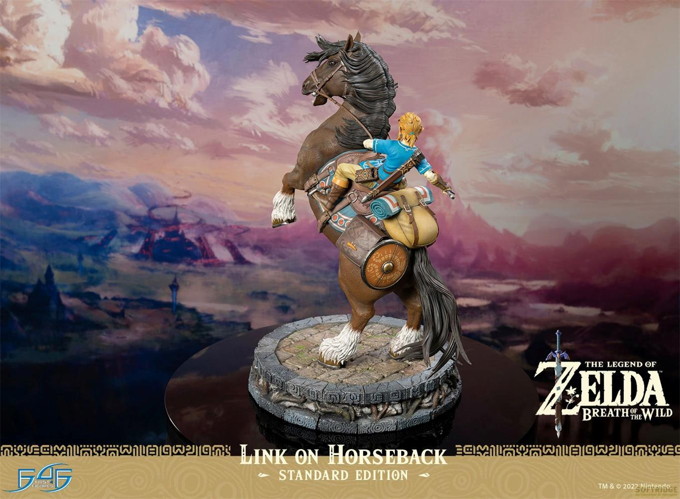 Link sur un cheval brun cabré devant un paysage montagneux.
