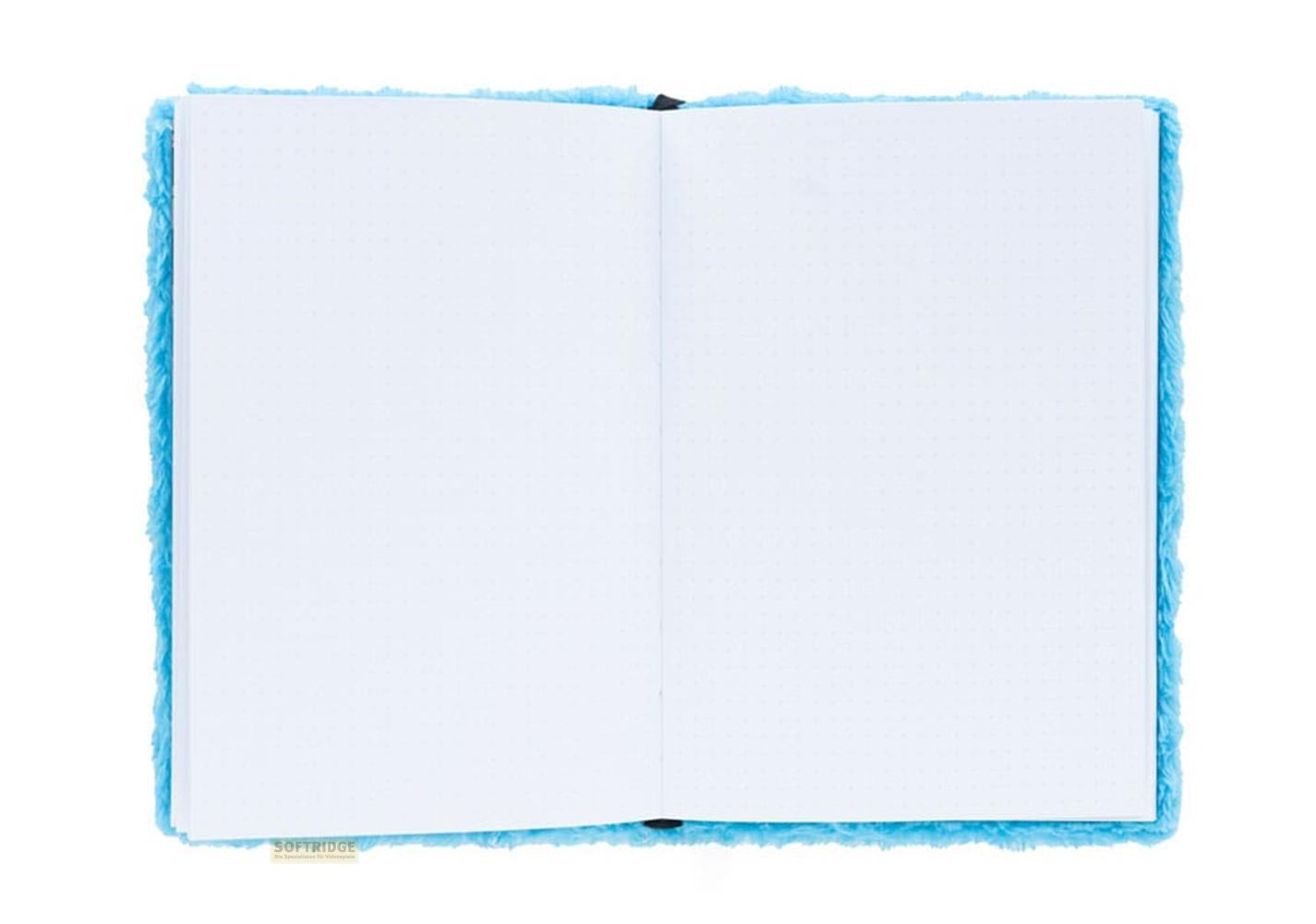 Un cuaderno abierto con bordes difusos azules y páginas punteadas.