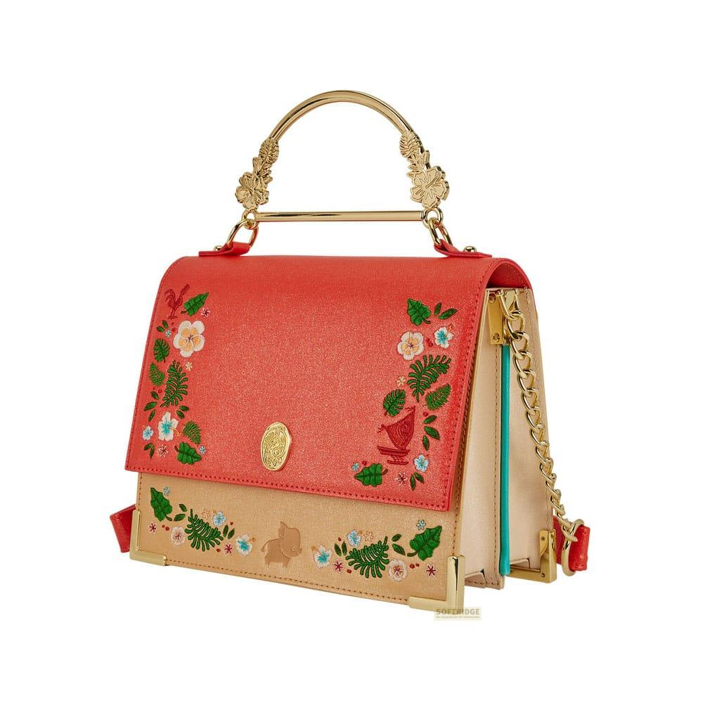 Un bolso rojo y beige con bordado floral y asa dorada.