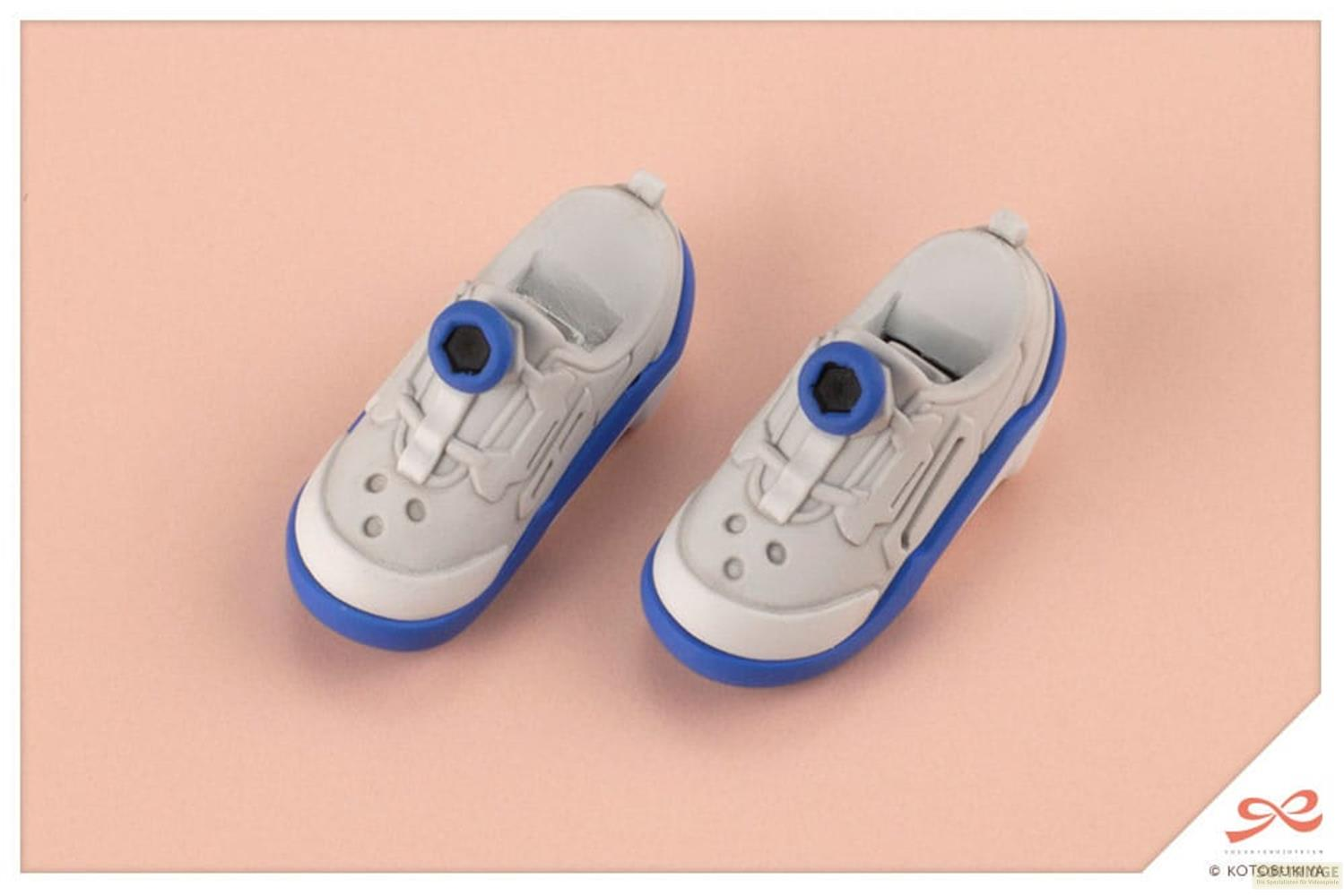 Zwei graue Sneaker-Radiergummis mit blauen Sohlen und Schnürsenkel-Details.