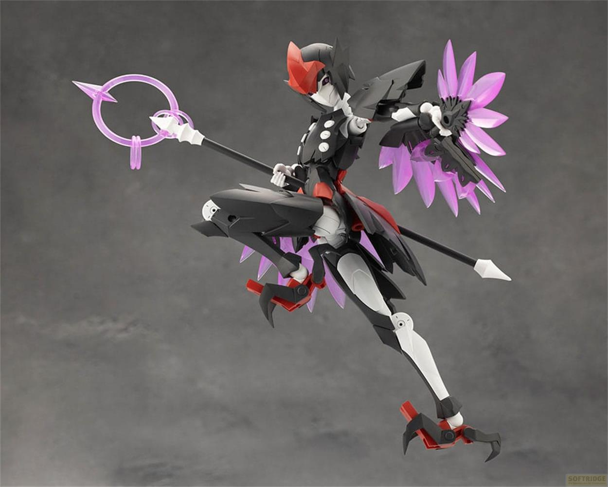 Une figurine noire et blanche aux accents rouges tient un bâton avec un anneau violet.