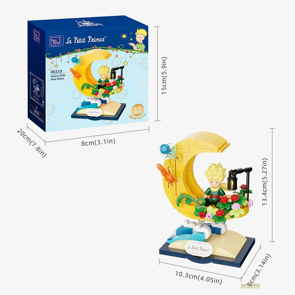 Set de construcción Le Petit Prince con figura en luna, rosas y mariposa.